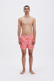 Red Swim Shorts with 'Le Bel Été' print, a stylish collaboration by Edith Carron.