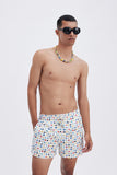 White Swim Shorts with 'Lucky Charms' print, a stylish collaboration by Mary Matson.