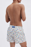 White Swim Shorts with 'Lucky Charms' print, a stylish collaboration by Mary Matson.