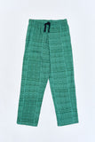 Green Iconic Pants with 'Leone' print, a stylish collaboration by Uberta Zambeletti.